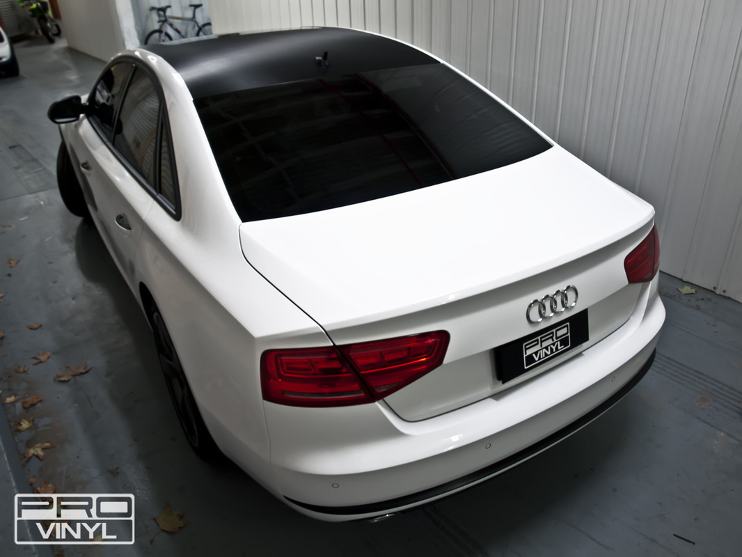  In this low riding audi a8. vinyl wrap has only been applied to the roof, side mirrors, front grille and badgework