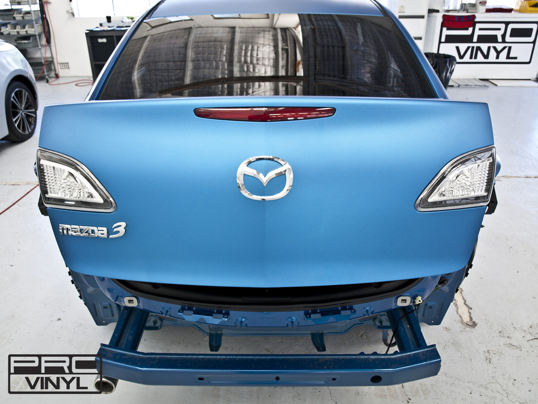 Mazda 3 with its sharp new metallic matte blue wrap