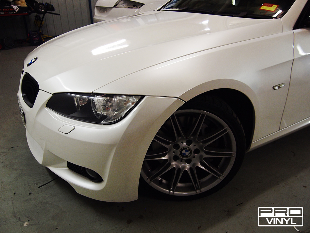 BMW 335 with a full body wrap in pearl white vinyl