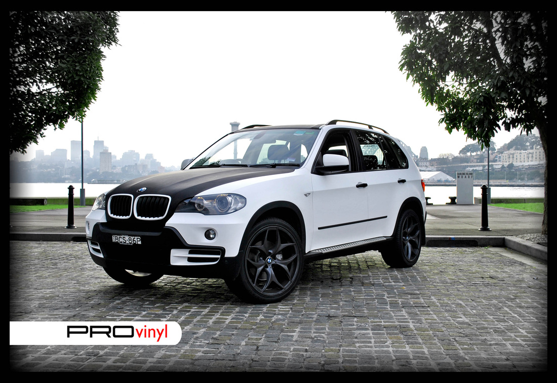 BMW X5 fully wrapped in matte white with carbon fibre bonnet | Sydney