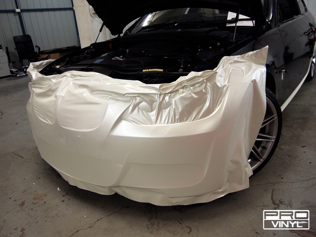 BMW 335 with a full body wrap in pearl white vinyl
