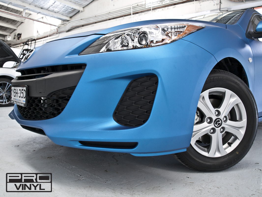 Mazda 3 with its sharp new metallic matte blue wrap